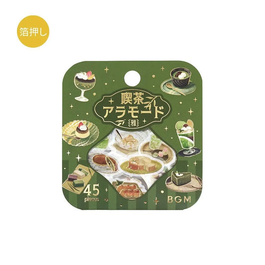 Green matcha-themed café flake sticker sheet with illustrated desserts, tea bowls and small plates accented with foil.