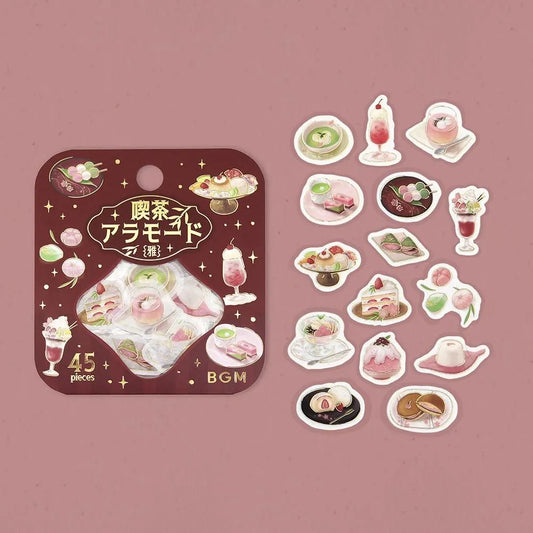 Pink-toned café flake stickers showing cakes, parfaits and delicate desserts with warm foil accents on washi paper.