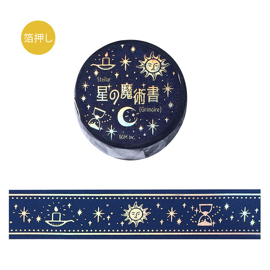 A roll of BGM washi tape in deep midnight blue featuring celestial motifs—sun, moon, hourglass, and stars—accented with shimmering foil from the Grimoire of Stars collection.