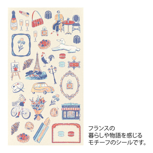 A sheet of Midori French Motifs washi stickers illustrated by Yuuka Takamaru, featuring frame stickers with traditional patterns, along with distinctive motifs like local foods, animals, flowers, and landmarks. The soft pastel colors give the sheet an elegant and travel-inspired feel, ideal for decorating planners and notebooks.