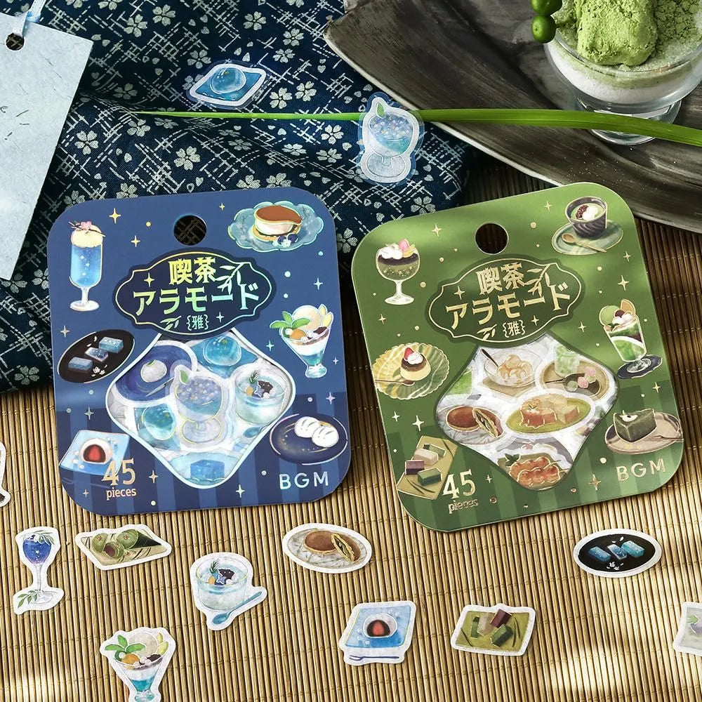 Sheet of blue and green themed café flake stickers showing petite plates, parfaits, jelly desserts and drinks with shimmering foil highlights.