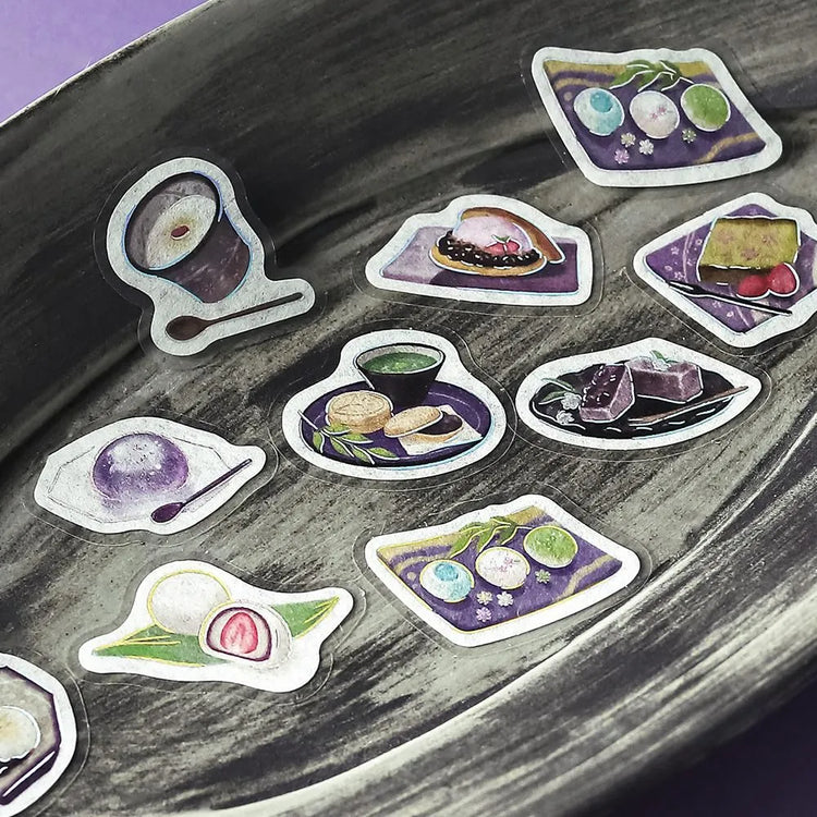 Purple café-themed flake sticker sheet featuring traditional sweets, tea cups and parfaits with metallic foil details.