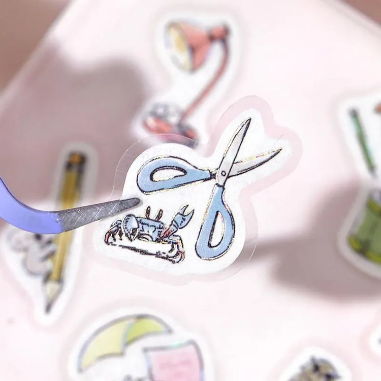 BGM Foil Stamping Flake Seal – Mini Mini Animals: Stationery with 45 washi stickers featuring adorable animals interacting with notebooks, pens, scissors, and other stationery items—enhanced with gold foil accents and a textured finish.