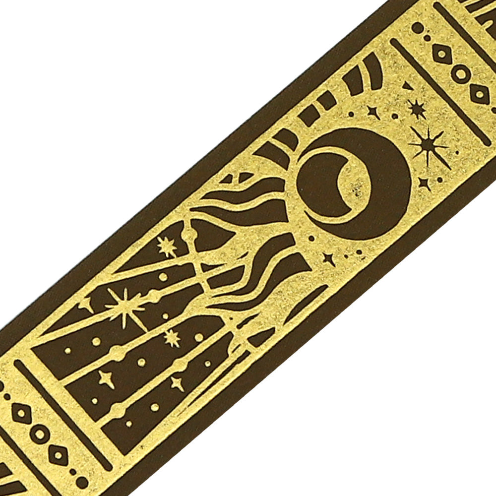 A roll of gold-toned washi tape with celestial suns, moons, and foil accents from the Grimoire of Stars Holy edition.