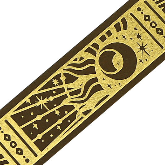 A roll of gold-toned washi tape with celestial suns, moons, and foil accents from the Grimoire of Stars Holy edition.