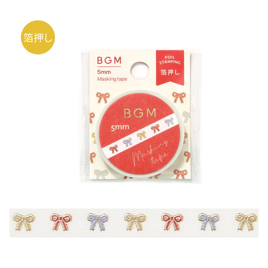 A roll of washi tape decorated with cute ribbon patterns highlighted by metallic foil, adding a playful and sparkling detail to journals, planners, and craft projects.