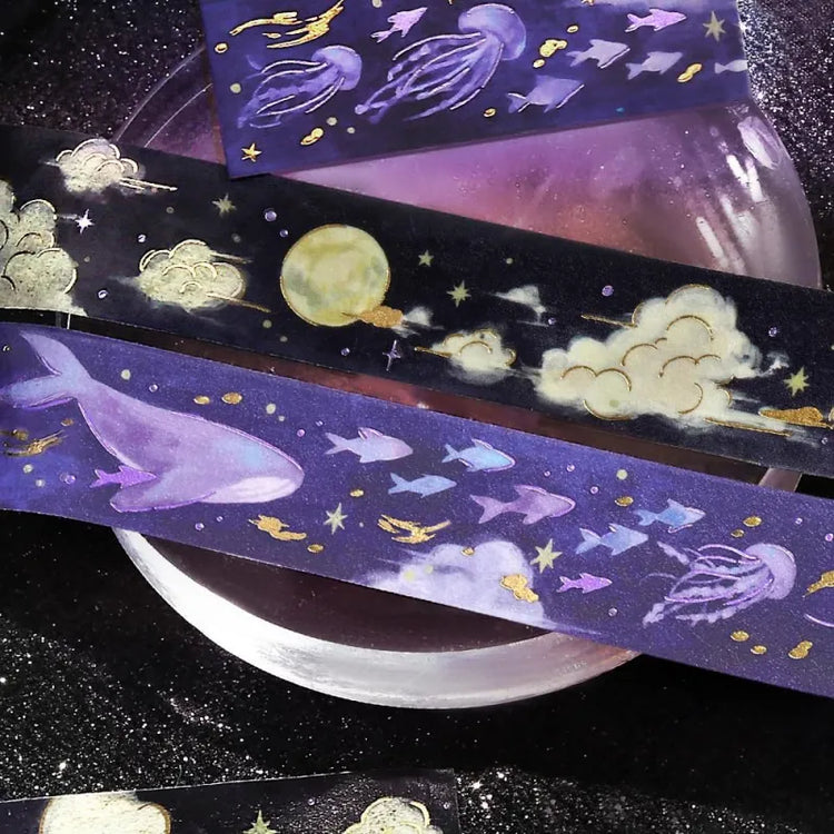 BGM Foil Stamping Masking Tape – Sky Encyclopedia: Night Calm 20mm washi tape roll designed with whales and jellyfish in a purple starry sky, accented with gold foil moons and celestial motifs.