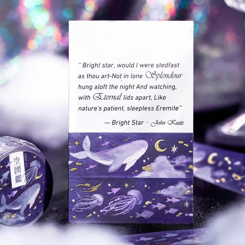 BGM Foil Stamping Masking Tape – Sky Encyclopedia: Night Calm 20mm washi tape roll designed with whales and jellyfish in a purple starry sky, accented with gold foil moons and celestial motifs.