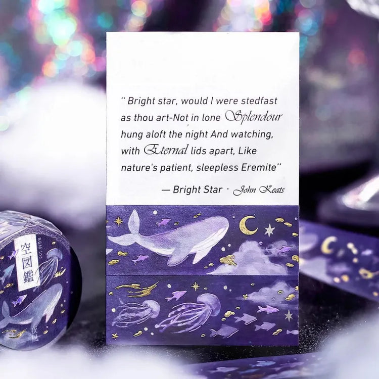 BGM Foil Stamping Masking Tape – Sky Encyclopedia: Night Calm 20mm washi tape roll designed with whales and jellyfish in a purple starry sky, accented with gold foil moons and celestial motifs.