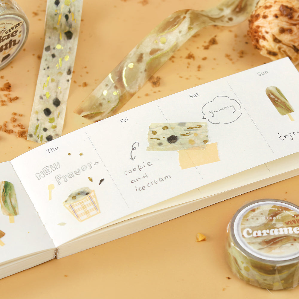 A roll of BGM washi tape in a caramel-inspired design with golden foil accents, styled to resemble sweet dessert drizzles, ideal for journaling, scrapbooking, and decoration.
