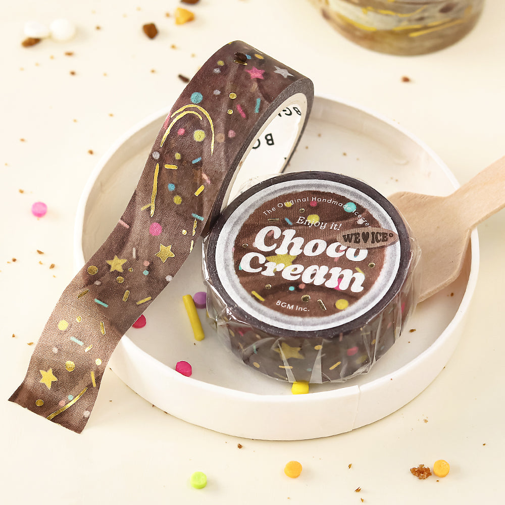 A roll of BGM washi tape with a chocolate-and-cream swirl design, accented with shimmering foil, from the We Love ICE collection.
