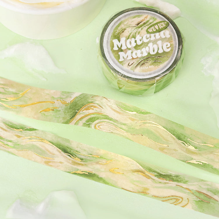 A roll of BGM washi tape in a matcha marble design with foil accents, inspired by green tea ice cream. Perfect for journaling, scrapbooking, and creative decoration.