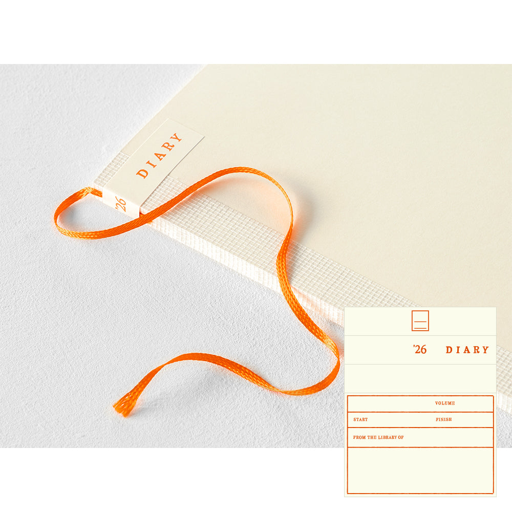 MD Notebook Diary (A5) Thin 2026 – A slim, thread-bound diary with a minimalist cream cover and glassine paper wrap, featuring monthly schedule pages, 5mm grid memo pages, and a bookmark string. Compact and lightweight, designed for portability and everyday use.