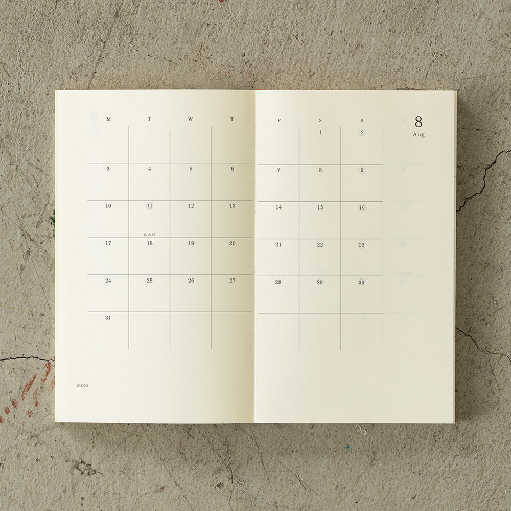 Featuring monthly, weekly, and plain memo pages, this minimalist diary is made with MD PAPER for an exceptional writing experience and flat-opening durability—perfect for planners who value both function and creativity.