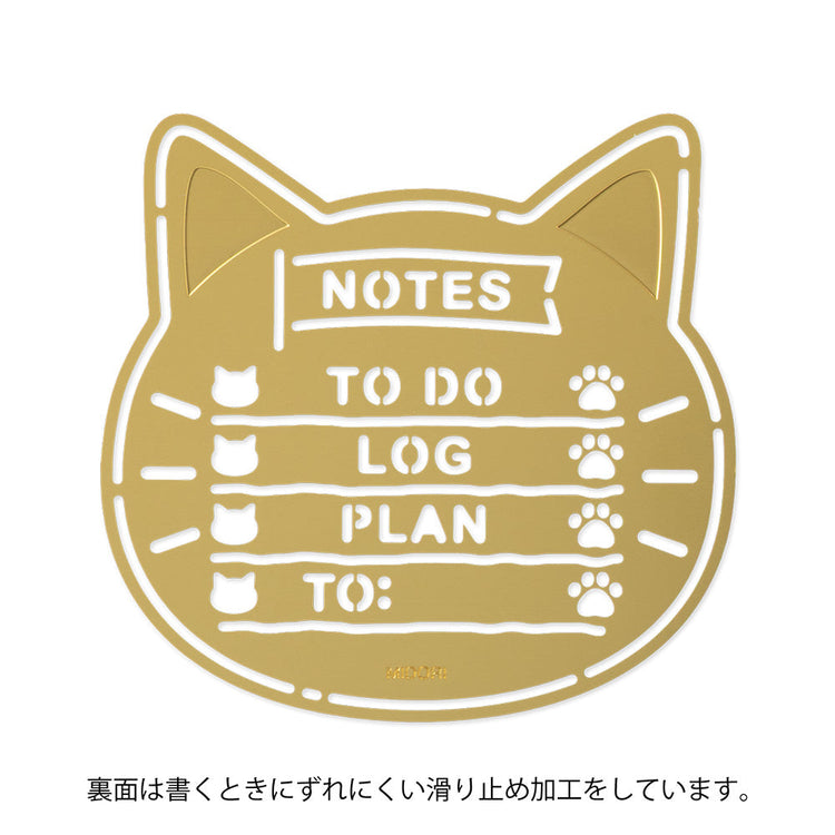 A slim brass stencil with cut-out cat faces, paw prints, and checklist boxes, designed for decorating planners, notebooks, and memos.