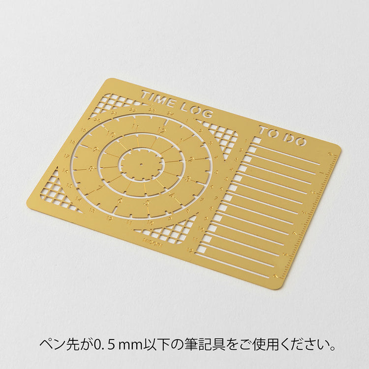A slim brass stencil featuring circular cut-outs for 12-hour and 24-hour time logs, along with sections for to-do lists and vertical layouts. Designed for planners and notebooks, with a non-slip back for easy tracing.