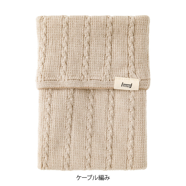 Midori Notebook’s HARAMAKI A6～B6 in Beige, shown in packaging. A soft cable-knit pouch with flap cover, designed to wrap around a planner like a belly warmer, with stretchable pockets for pens and small essentials.