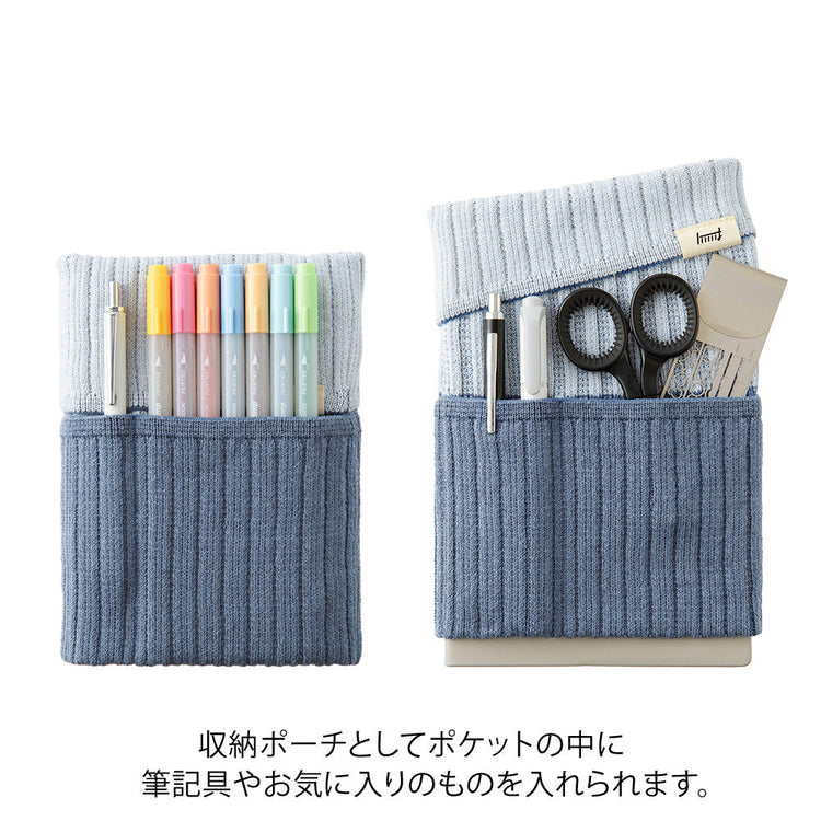 Midori Notebook’s HARAMAKI A6～B6 in Two-tone Gray, shown in packaging. A soft cable-knit pouch with flap cover, designed to wrap around a planner like a belly warmer, with stretchable pockets for pens and small essentials.