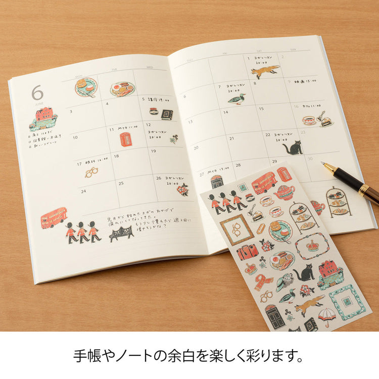 Sheet of Midori washi stickers illustrated by Yuuka Takamaru, featuring soft-toned British motifs such as teacups, flowers, patterned frames, and iconic landmarks. The elegant designs evoke the charm of British culture and are perfect for decorating planners and journals.