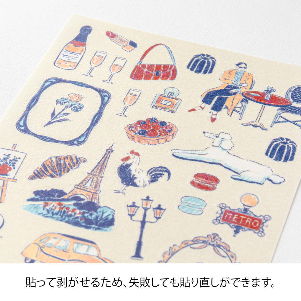 A sheet of Midori French Motifs washi stickers illustrated by Yuuka Takamaru, featuring  frame stickers with traditional patterns, along with distinctive motifs like local foods, animals, flowers, and landmarks. The soft pastel colors give the sheet an elegant and travel-inspired feel, ideal for decorating planners and notebooks.