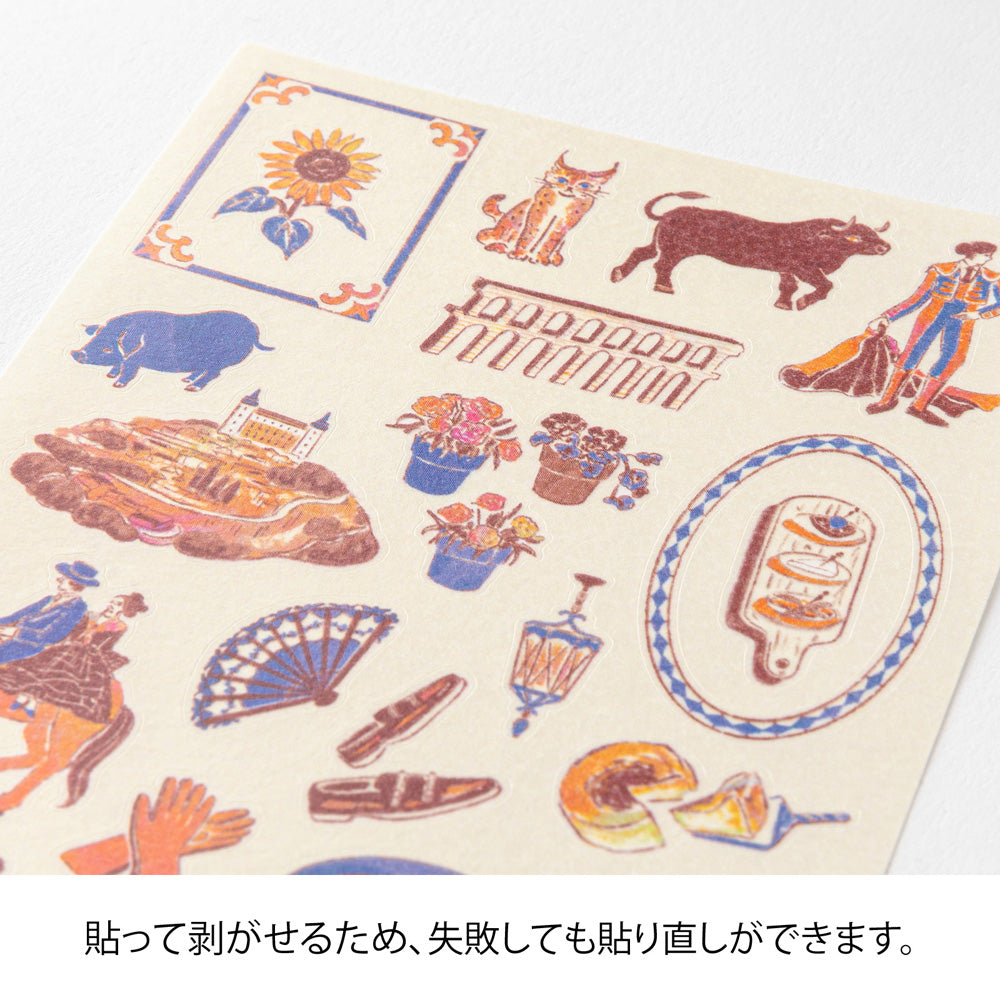A sheet of Midori Spanish Motifs washi stickers by Yuuka Takamaru, featuring playful illustrations such as flamenco dancers, paella, bulls, guitars, and colorful Spanish tile patterns. Designed in soft pastel hues, these stickers evoke the lively charm and warmth of Spain.