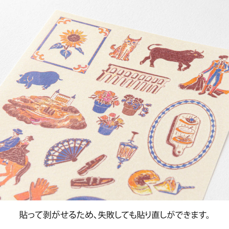 A sheet of Midori Spanish Motifs washi stickers by Yuuka Takamaru, featuring playful illustrations such as flamenco dancers, paella, bulls, guitars, and colorful Spanish tile patterns. Designed in soft pastel hues, these stickers evoke the lively charm and warmth of Spain.
