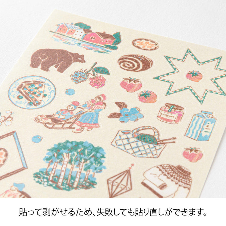 A sheet of Midori Finnish Motifs washi stickers by Yuuka Takamaru, with illustrations of reindeer, Nordic cottages, pine trees, berries, and folk embroidery patterns. The soft, pastel palette evokes the peaceful charm and traditions of Finland.