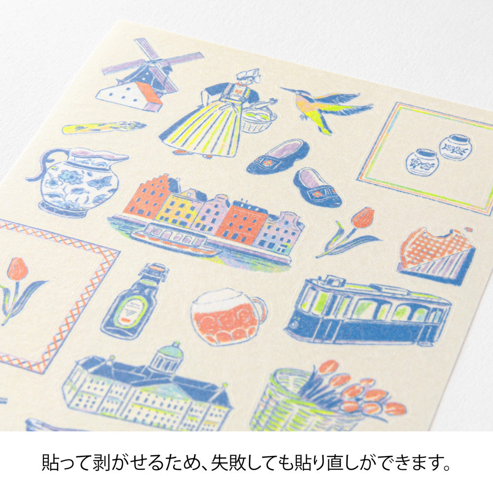 A sheet of Midori Dutch Motifs washi stickers illustrated by Yuuka Takamaru, with charming designs of tulips, windmills, bicycles, clogs, and folk-style frames in soft pastel tones, evoking the cheerful spirit of the Netherlands.