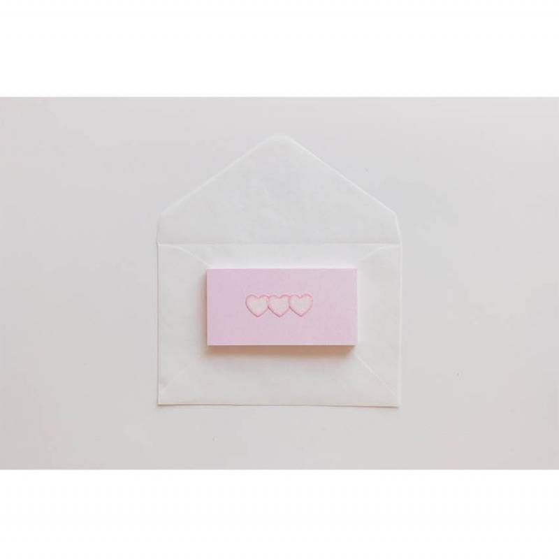 A single sheet of Suatelier Daily Deco Sticker – Love Heart, featuring rows of hand-drawn heart illustrations in different shapes, colors, and sizes on translucent paper.