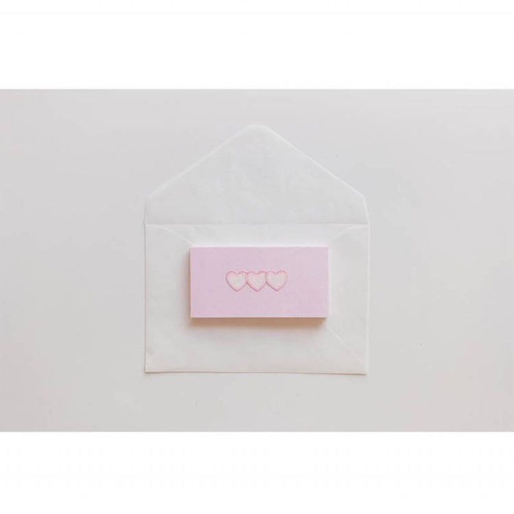 A single sheet of Suatelier Daily Deco Sticker – Love Heart, featuring rows of hand-drawn heart illustrations in different shapes, colors, and sizes on translucent paper.